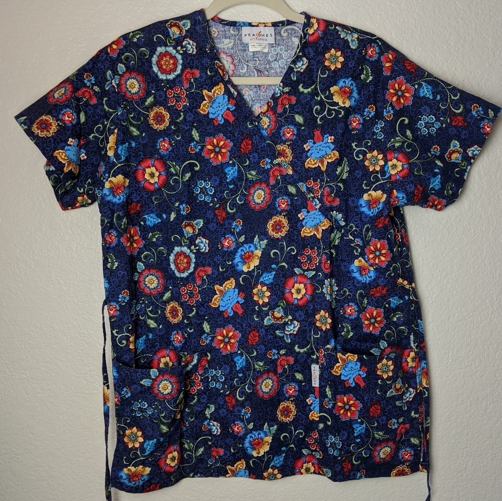 2/$17 Peaches navy floral scrub top. Sz S.